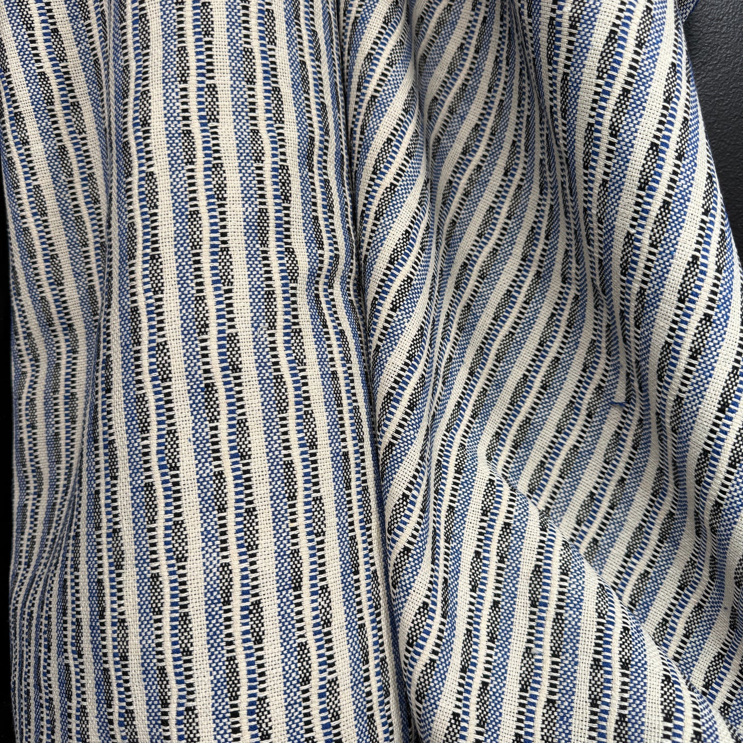 The Heritage Stripe Collection - Jacquard Tapestry in blue, black, and natural tones showcasing textured woven fabric with classic vertical stripes.