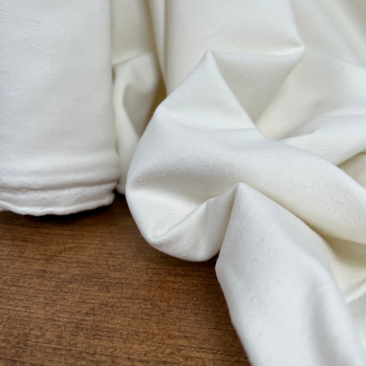 Hemp Organic Cotton Spandex Jersey 240 gsm in natural color, featuring a soft and breathable texture ideal for various fabric projects.